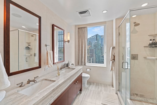 80 Riverside Blvd Unit 16-P, New York City, NY 10069 - bathroom featuring double vanity, toilet, a stall shower, and recessed lighting