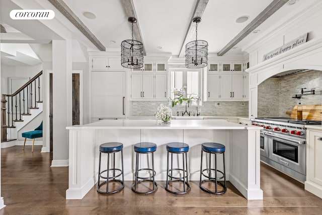 8119 Ridge Blvd, New York City, NY 11209 - kitchen featuring a sink, a chandelier, beamed ceiling, double oven range, and visible vents