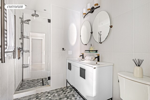 8119 Ridge Blvd, New York City, NY 11209 - bathroom with tile walls, toilet, vanity, and a stall shower