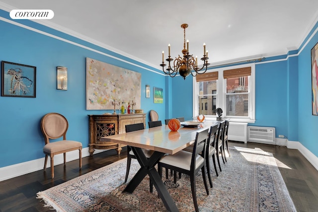 dining room featuring crown molding, baseboards, visible vents, and a notable chandelier