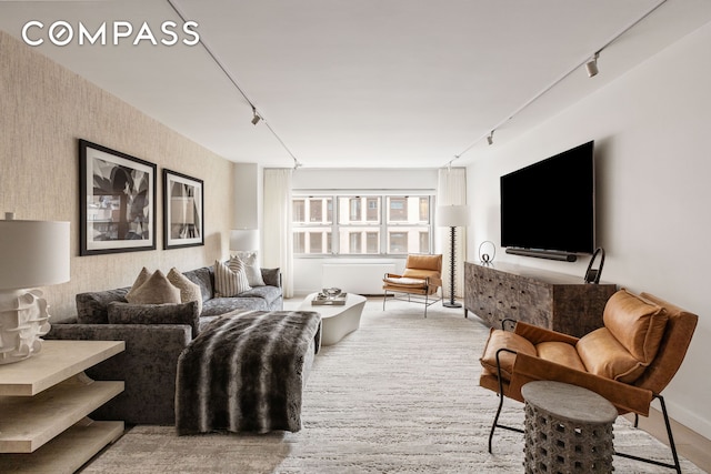 living room featuring wallpapered walls and track lighting