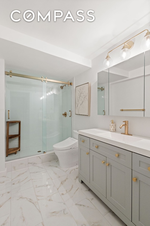 full bathroom featuring a shower stall, vanity, marble finish floor, and toilet
