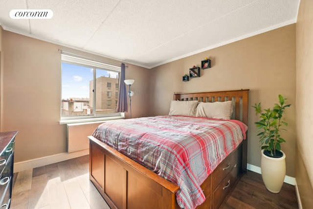 68 Bradhurst Ave Unit 6V, New York City, NY 10030 - bedroom with baseboards and wood finished floors