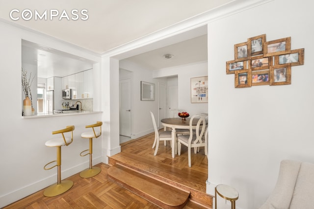 325 E 77th St Unit 1E, New York City, NY 10075 - dining area with baseboards