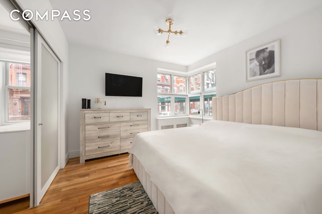 325 E 77th St Unit 1E, New York City, NY 10075 - bedroom featuring light wood-style floors and baseboards