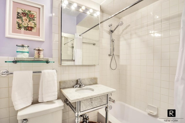 bathroom with tasteful backsplash, tile walls, toilet, a sink, and shower / tub combo