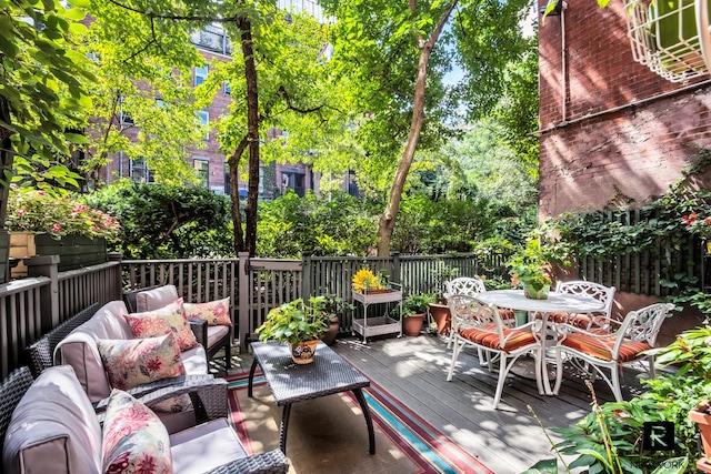 exterior space with outdoor lounge area and outdoor dining area