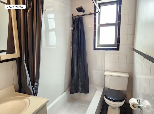 bathroom featuring vanity, toilet, a shower with curtain, and tile walls