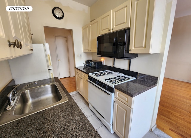 762 Brady Ave Unit 621, New York City, NY 10462 - kitchen featuring white appliances, a sink, and light wood finished floors