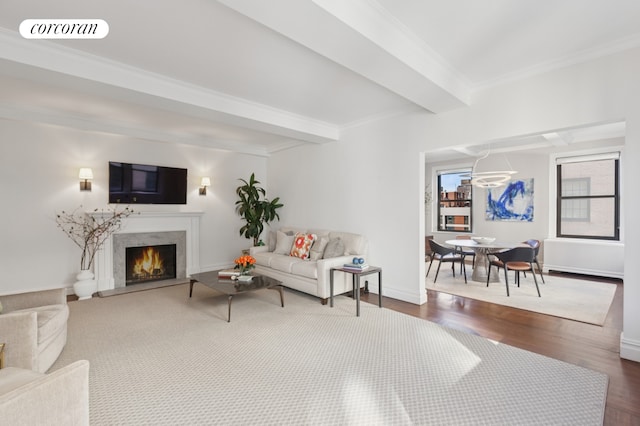 living area with crown molding, dark wood-style flooring, a fireplace, beamed ceiling, and visible vents
