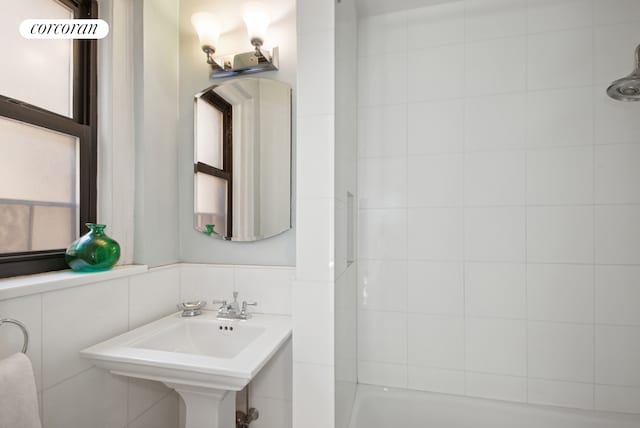 full bathroom with a sink