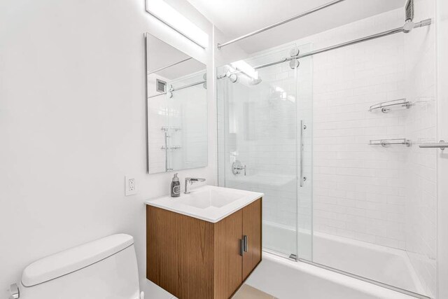 444 E 86th St Unit 21J, New York City, NY 10028 - laundry room with electric panel, light wood-type flooring, stacked washer / drying machine, and laundry area