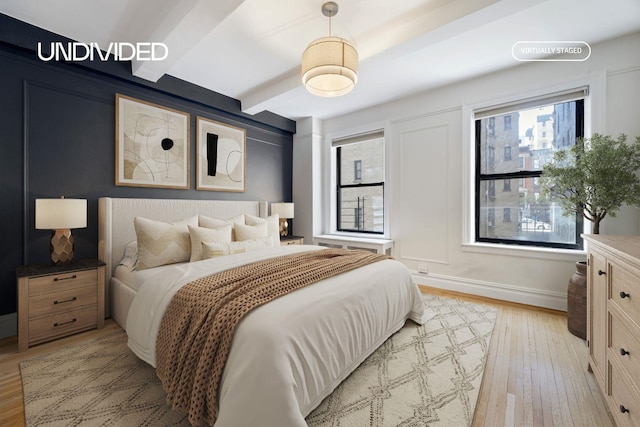 130 E 94th St Unit 2-E, New York City, NY 10128 - bedroom featuring light wood finished floors, multiple windows, and beam ceiling