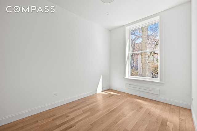 119 Henry St Unit 3, New York City, NY 11201 - empty room featuring light wood-type flooring, baseboards, and a baseboard radiator