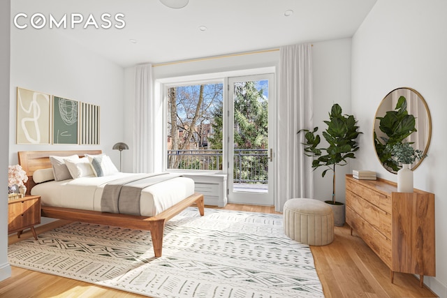 119 Henry St Unit 3, New York City, NY 11201 - bedroom featuring light wood-style floors and access to outside