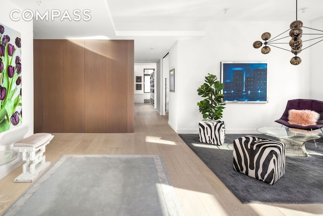living room with baseboards and wood finished floors