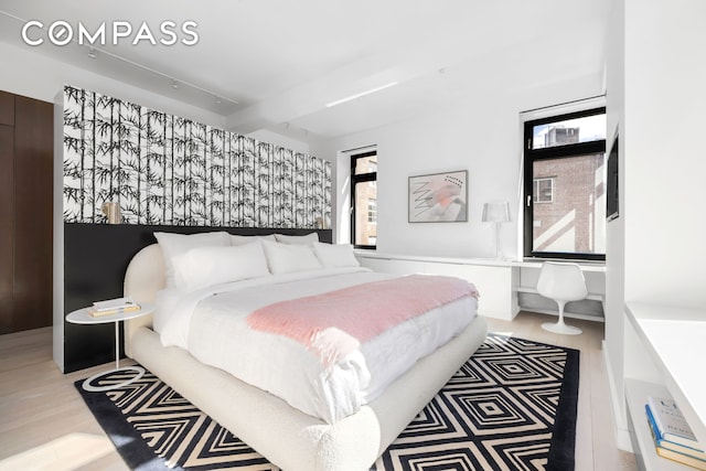 bedroom with wood finished floors