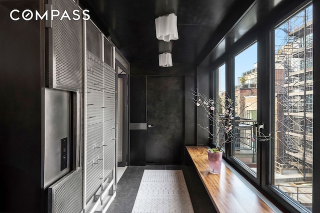 interior space featuring a wealth of natural light and tile patterned floors