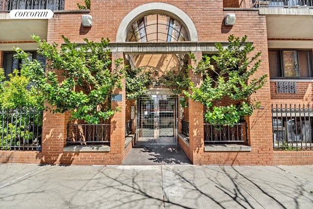 property entrance with brick siding