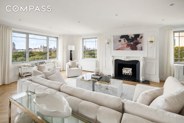 living room featuring a premium fireplace