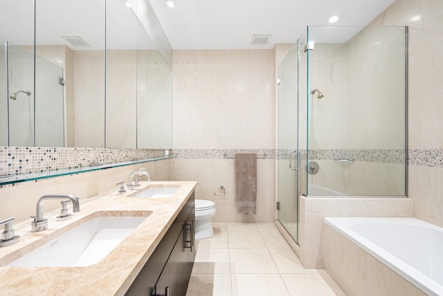325 5th Ave Unit 34D, New York City, NY 10016 - full bath with tile walls, a stall shower, a garden tub, toilet, and double vanity