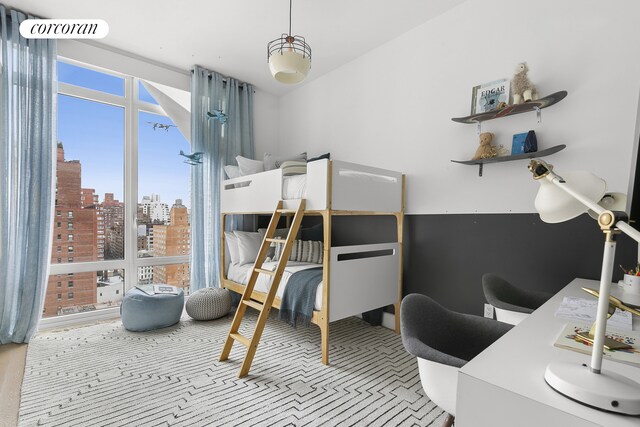 bedroom featuring a view of city, visible vents, and carpet