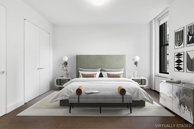bedroom featuring wood finished floors
