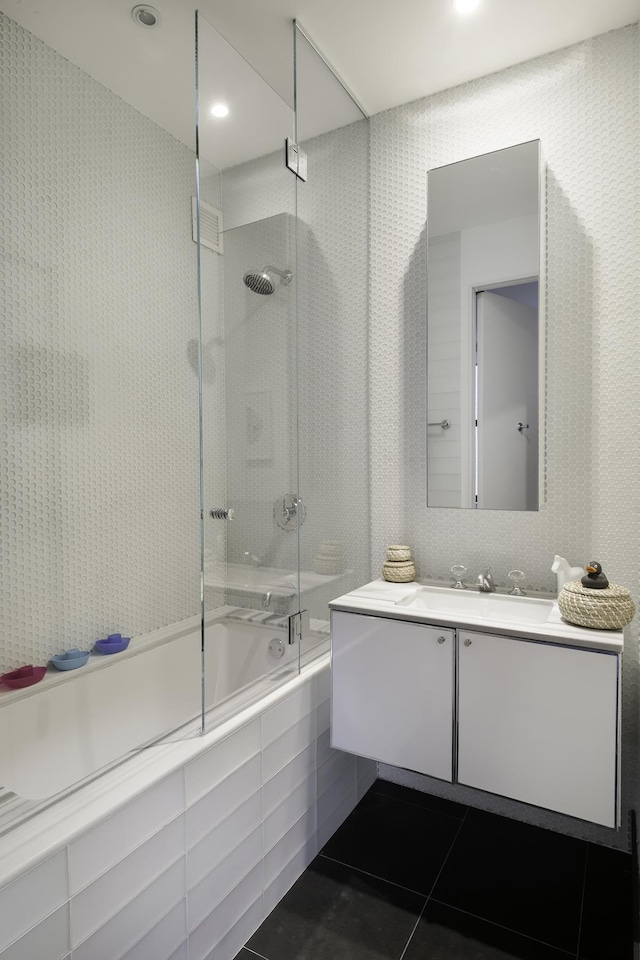 bathroom with shower / bath combination with glass door, tile patterned floors, and vanity