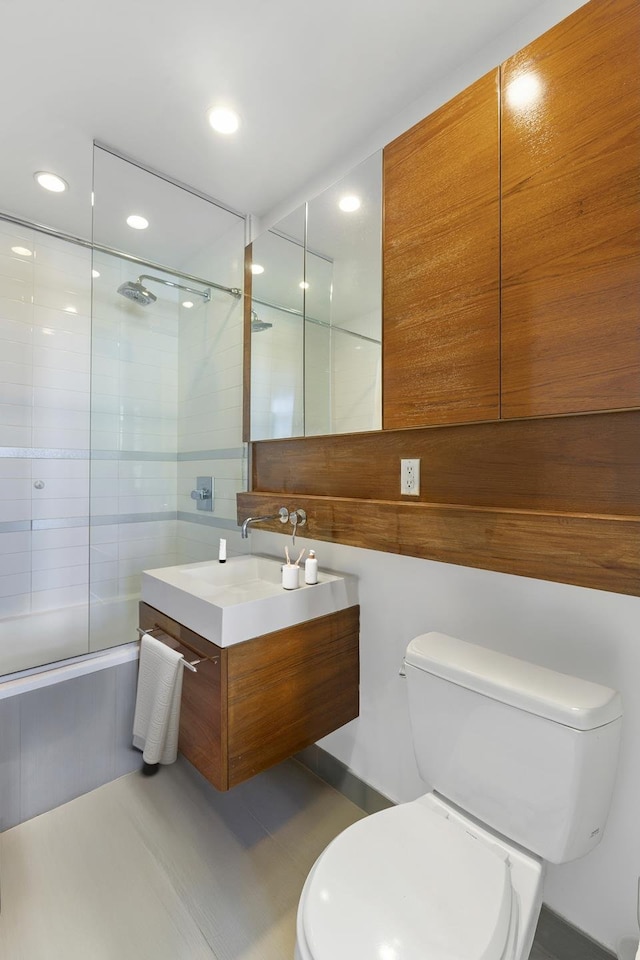 333 E 109th St Unit 4E, New York City, NY 10029 - full bathroom with toilet, vanity, shower / tub combination, and recessed lighting