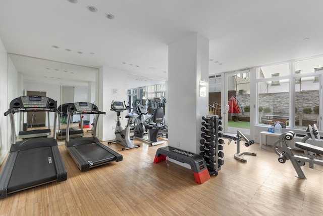 exercise room with wood finished floors