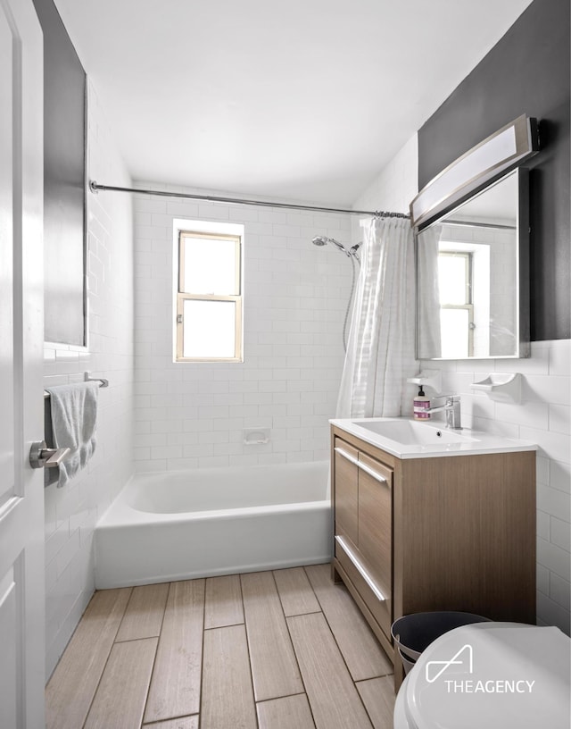 225 E 76th St Unit 5A, New York City, NY 10021 - full bathroom with shower / tub combo with curtain, vanity, toilet, and wood finished floors