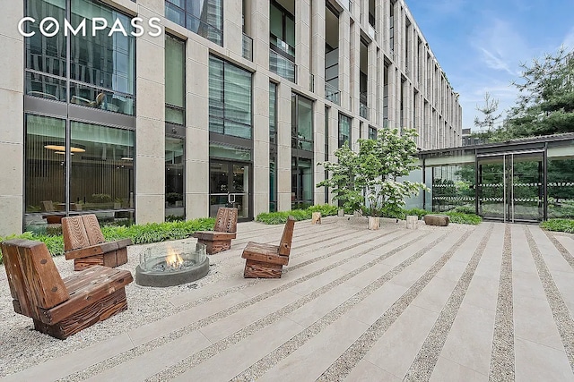 view of home's community featuring a fire pit
