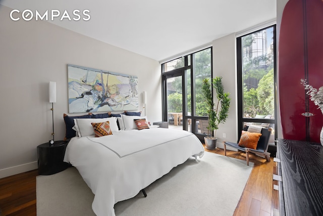 101 Warren St Unit 590, New York City, NY 10007 - bedroom with floor to ceiling windows and wood finished floors
