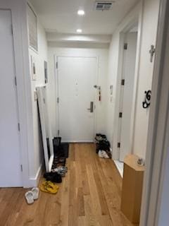 doorway with light wood-type flooring