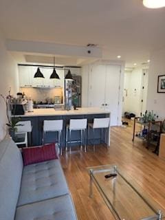 living room featuring wood finished floors and recessed lighting
