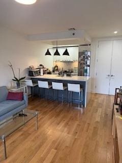 bar with light wood-style floors