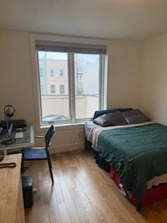 bedroom featuring light wood-style floors