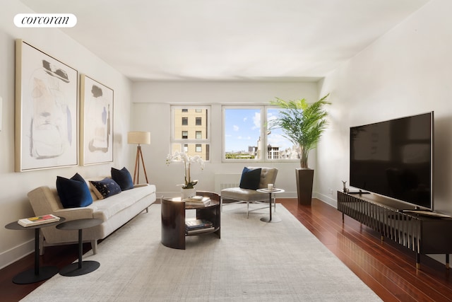 58 W 58th St Unit 24B, New York City, NY 10019 - living room with wood finished floors and baseboards