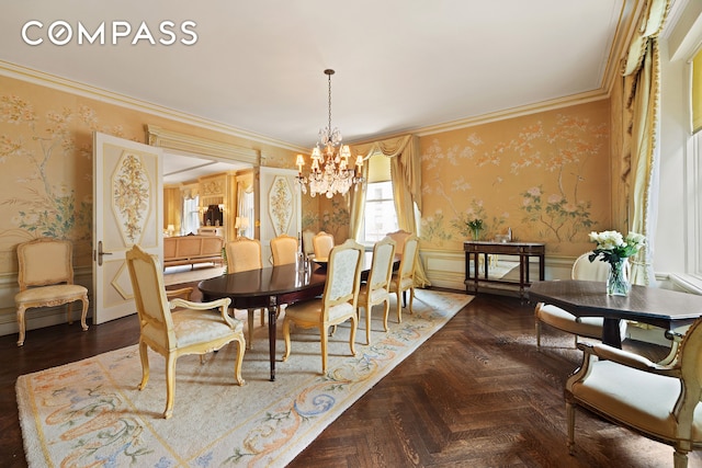 31 E 72nd St Unit 4B, New York City, NY 10021 - dining space with wallpapered walls, a chandelier, a wainscoted wall, and crown molding