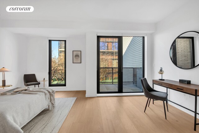28 Huntington St, New York City, NY 11231 - bedroom with wood finished floors and access to outside
