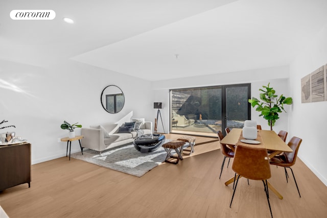 28 Huntington St, New York City, NY 11231 - living room featuring light wood-style floors and baseboards