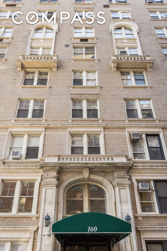 view of building exterior with cooling unit