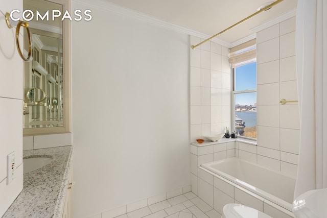 bathroom with tile patterned flooring, a water view, toilet, ornamental molding, and a bathing tub