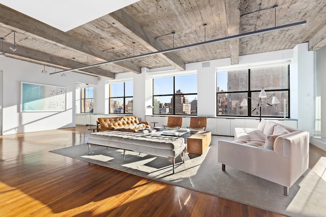 205 W 19th St Unit 11, New York City, NY 10011 - living room with wood finished floors and beamed ceiling