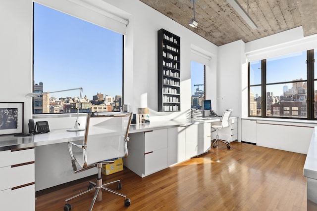 205 W 19th St Unit 11, New York City, NY 10011 - office area featuring built in desk and wood finished floors