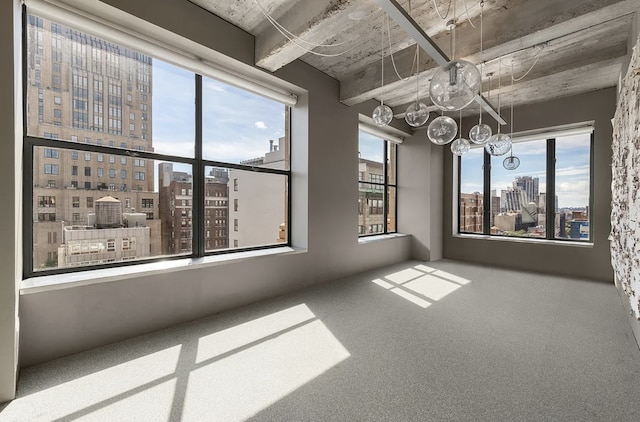 205 W 19th St Unit 11, New York City, NY 10011 - unfurnished room with a city view, a chandelier, and carpet floors
