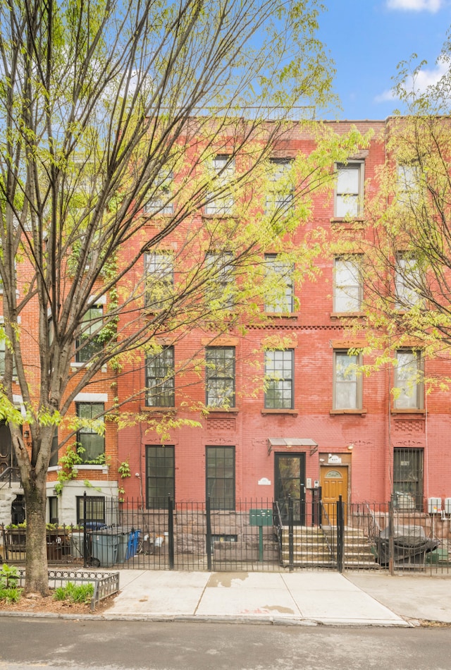 view of property featuring a fenced front yard