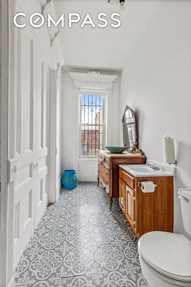 480A Mac Donough St, New York City, NY 11233 - bathroom with vanity, toilet, and tile patterned flooring