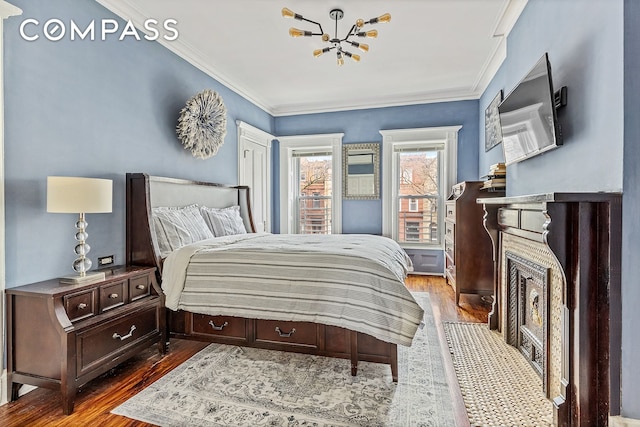 480A Mac Donough St, New York City, NY 11233 - bedroom featuring a chandelier, wood finished floors, and crown molding