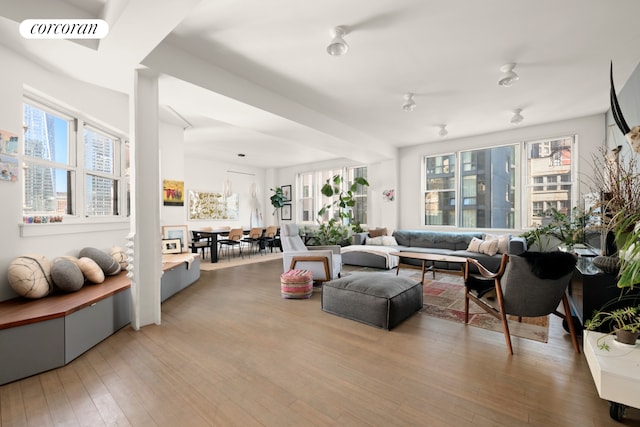 living room featuring light wood-style floors and visible vents